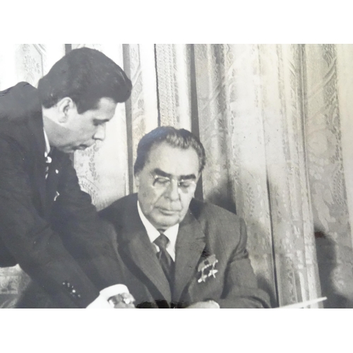 20 - A 20thC monochrome press photograph depicting Soviet leader Leonid Brezhnev and President Richard Ni... 