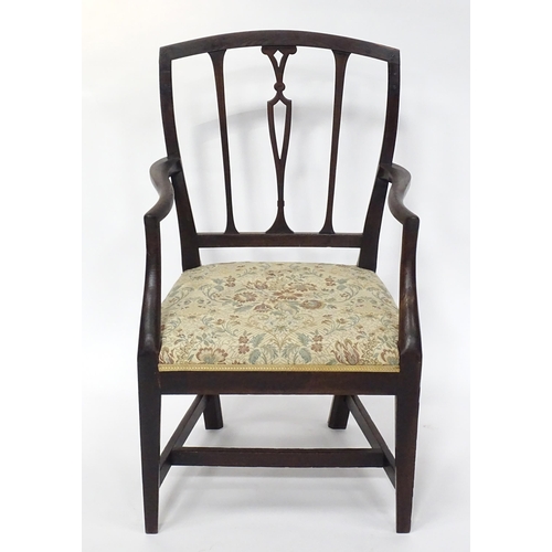 235 - A Hepplewhite design open armchair together with an early 20thC marquetry inlaid wine table. The tab... 