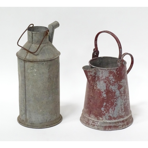 242 - Two barge ware style  galvanised iron water jugs. The tallest approx 17 1/2