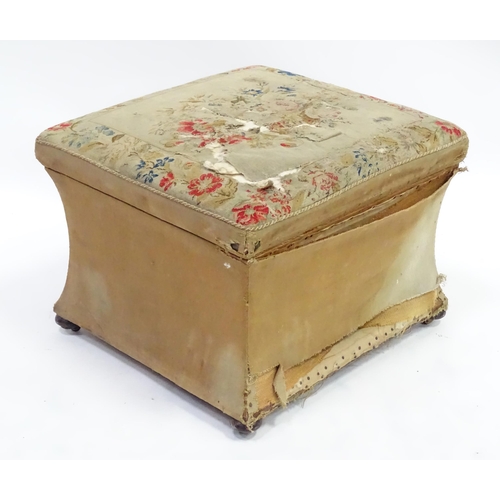 278 - A 20thC Ottoman with needlework top and lift lid above a concave shaped base and raised on squat bun... 