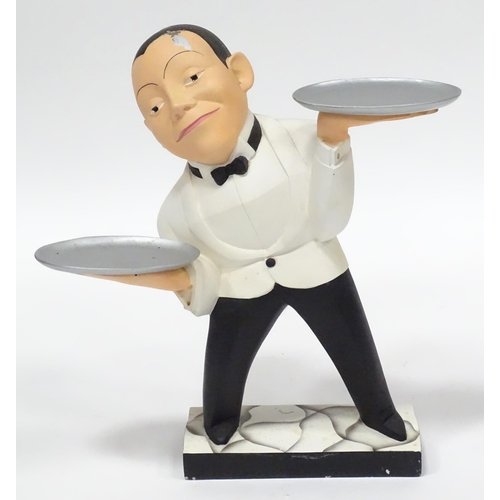 282 - A small novelty dumb waiter figure formed as a waiter holding two dishes. Approx 21 1/2