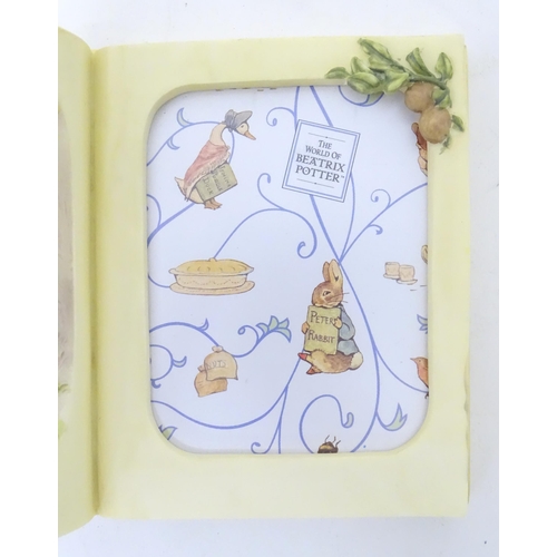 1379 - A The World of Beatrix Potter Benjamin Bunny book formed picture frame. Boxed. Approx. 6 1/2