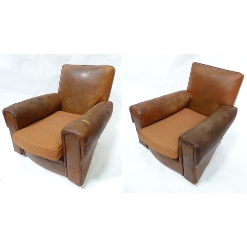 250 - A pair of mid 20thC leather club chairs. Approx. 33