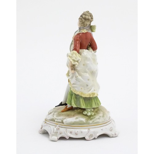 65 - A Karl Ens figural group depicting a gentleman and a lady on a shaped base. Marked under. Approx. 7 ... 