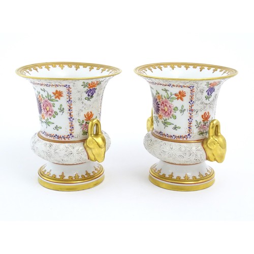 77 - A pair of French vases of twin handled urn form, the bodies decorated with armorial / heraldic coat ... 