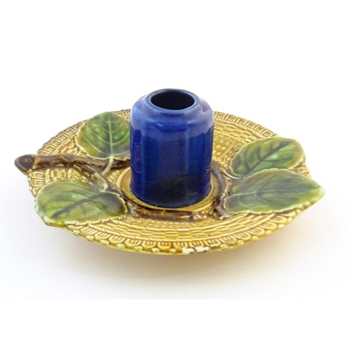 78 - A Bosh majolica inkwell / match keep / toothpick holder, the central pot flanked by apple leaf detai... 