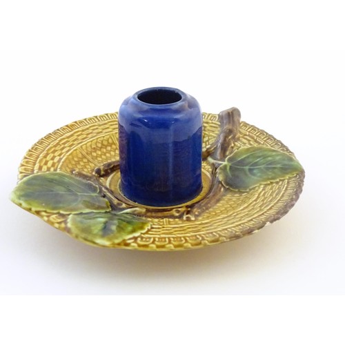 78 - A Bosh majolica inkwell / match keep / toothpick holder, the central pot flanked by apple leaf detai... 