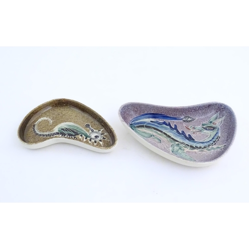 87 - Two studio pottery shaped dishes by Jo Lester, one with seahorse decoration, the other with dragon d... 