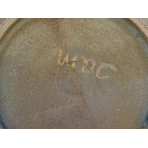 94 - A studio pottery bowl with abstract detail signed under Jam. Together with a studio pottery blue gla... 