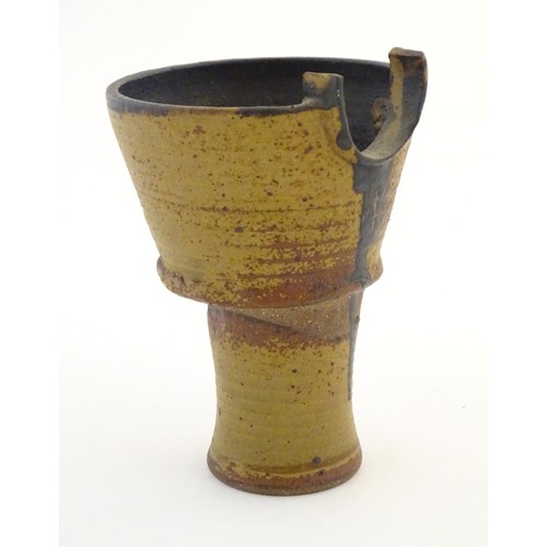 95 - An art pottery / studio pottery stylised goblet / vessel of conical form. Possibly Japanese. Approx.... 