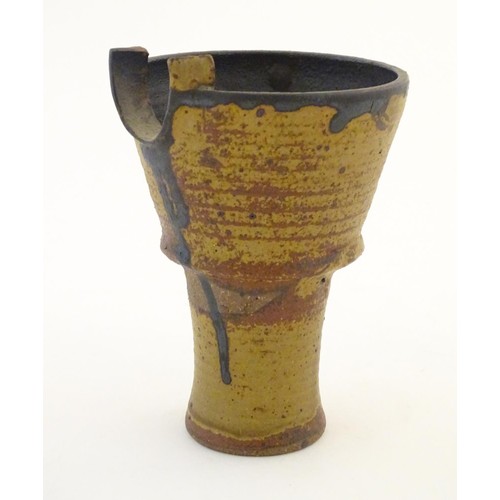 95 - An art pottery / studio pottery stylised goblet / vessel of conical form. Possibly Japanese. Approx.... 