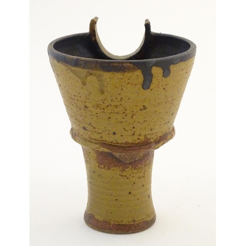 95 - An art pottery / studio pottery stylised goblet / vessel of conical form. Possibly Japanese. Approx.... 