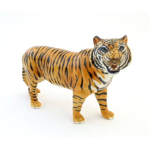 130 - A Beswick model of a tiger, model no. 2096. Marked under. Approx. 7 3/4