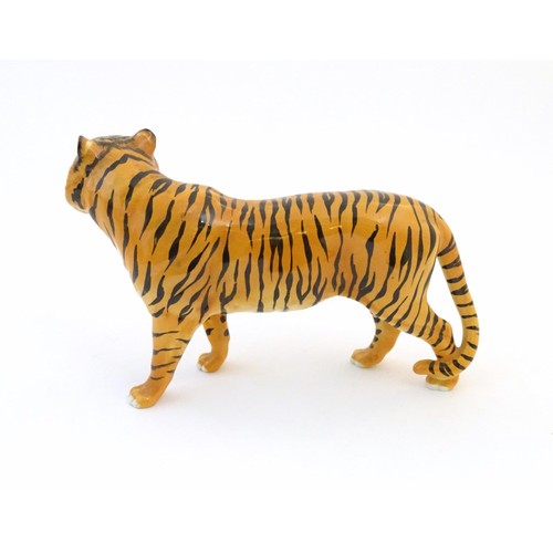 130 - A Beswick model of a tiger, model no. 2096. Marked under. Approx. 7 3/4