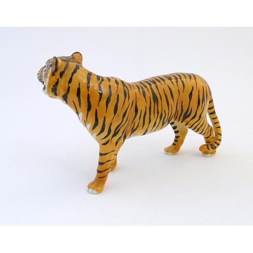 130 - A Beswick model of a tiger, model no. 2096. Marked under. Approx. 7 3/4