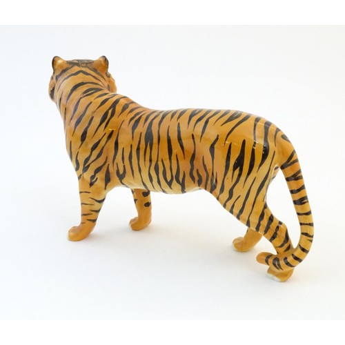 130 - A Beswick model of a tiger, model no. 2096. Marked under. Approx. 7 3/4