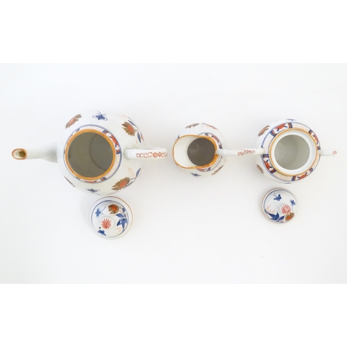 190 - A quantity of Oriental coffee wares decorated with flowers, foliage and stylised butterflies to incl... 