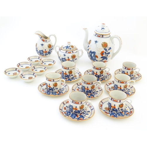 190 - A quantity of Oriental coffee wares decorated with flowers, foliage and stylised butterflies to incl... 