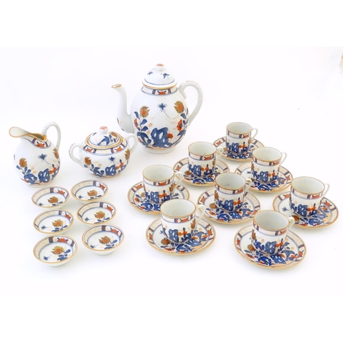 190 - A quantity of Oriental coffee wares decorated with flowers, foliage and stylised butterflies to incl... 