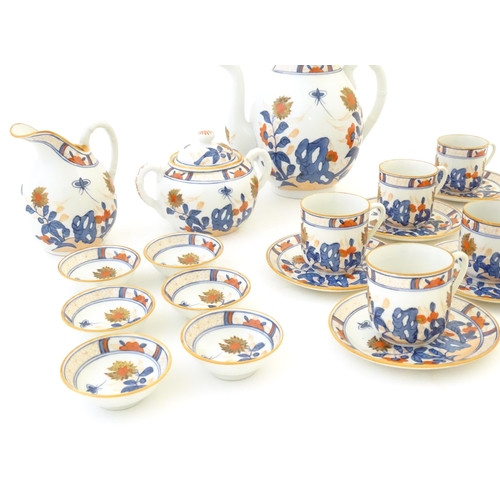 190 - A quantity of Oriental coffee wares decorated with flowers, foliage and stylised butterflies to incl... 