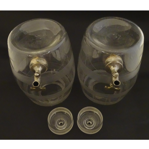 220 - Two Victorian glass spirit / rum  barrels with etched decoration and with silver plated taps. Approx... 