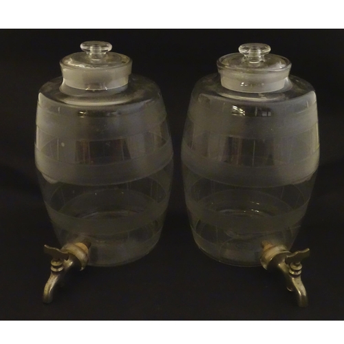 220 - Two Victorian glass spirit / rum  barrels with etched decoration and with silver plated taps. Approx... 