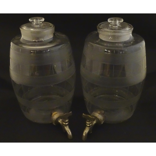 220 - Two Victorian glass spirit / rum  barrels with etched decoration and with silver plated taps. Approx... 