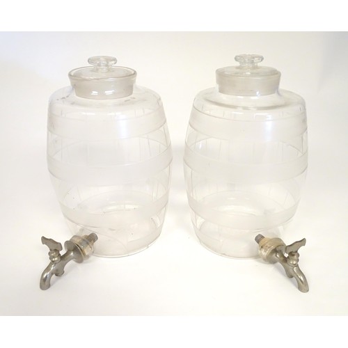 220 - Two Victorian glass spirit / rum  barrels with etched decoration and with silver plated taps. Approx... 