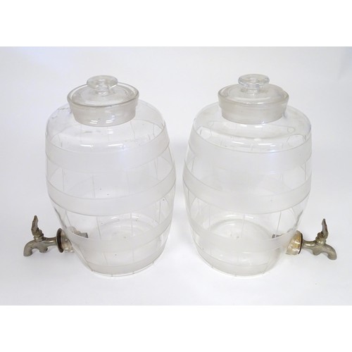 220 - Two Victorian glass spirit / rum  barrels with etched decoration and with silver plated taps. Approx... 