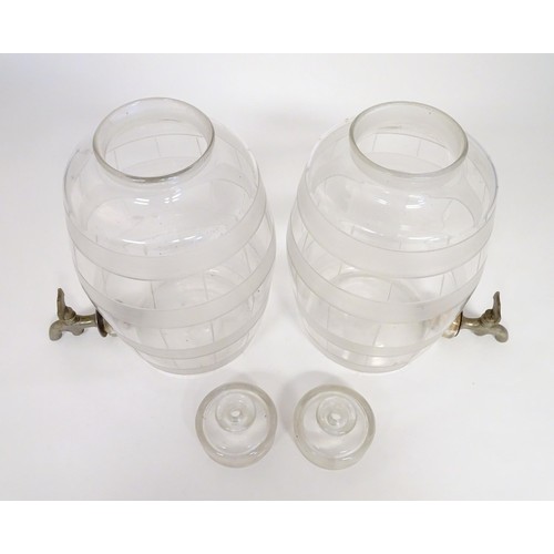 220 - Two Victorian glass spirit / rum  barrels with etched decoration and with silver plated taps. Approx... 