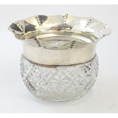 224 - A cut glass bowl with flared silver rim hallmarked Birmingham 1903 maker George Nathan & Ridley Haye... 