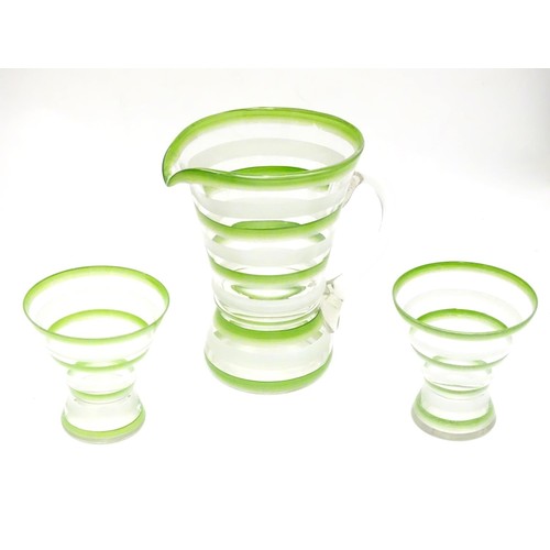 227 - An Art Deco lemonade set, with overpainted green and white banding, comprising jug and two beakers. ... 