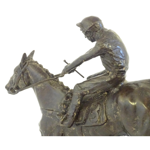 866 - A 20thC cast sculpture after David Geenty's Clearing The Last, depicting horse & jockey, on a marble... 