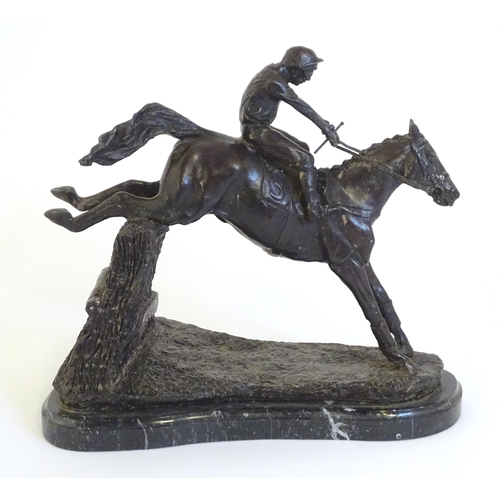 866 - A 20thC cast sculpture after David Geenty's Clearing The Last, depicting horse & jockey, on a marble... 