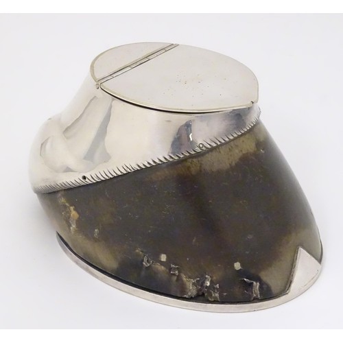 868 - Taxidermy: A late 19thC / early 20thC inkwell formed from a horse hoof with silver plate mounts. App... 