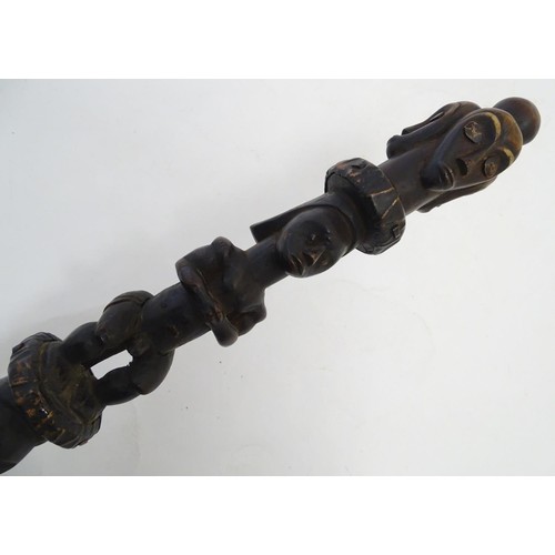 892 - Ethnographic / Native / Tribal: A carved African hardwood ceremonial staff composed of four carved f... 