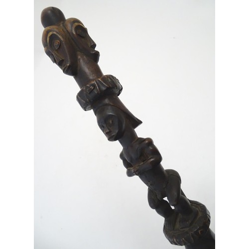 892 - Ethnographic / Native / Tribal: A carved African hardwood ceremonial staff composed of four carved f... 