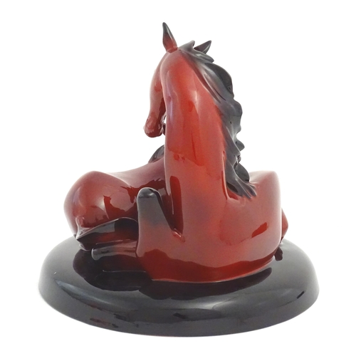 116 - A Royal Doulton flambe model of horses on a circular base, The Gift of Life, Mare and Foal. Marked u... 