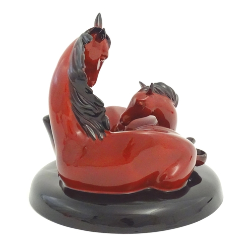 116 - A Royal Doulton flambe model of horses on a circular base, The Gift of Life, Mare and Foal. Marked u... 