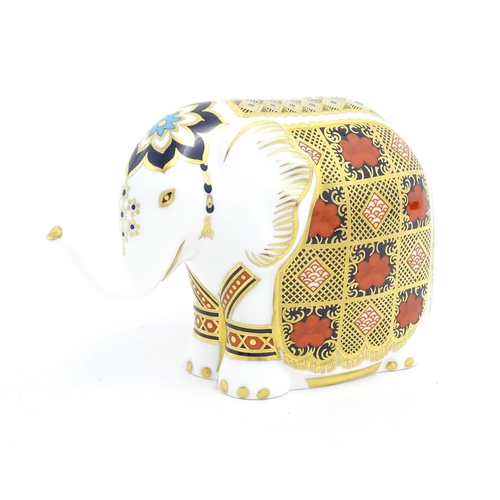 120 - A Royal Crown Derby paperweight modelled as an elephant. Marked under with gold stopper. Approx. 4