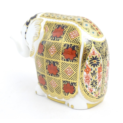 120 - A Royal Crown Derby paperweight modelled as an elephant. Marked under with gold stopper. Approx. 4