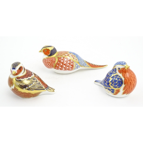 126 - Three Royal Crown Derby paperweights modelled as birds, comprising robin, chaffinch and pheasant. Ea... 