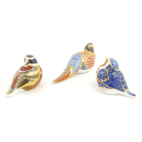 126 - Three Royal Crown Derby paperweights modelled as birds, comprising robin, chaffinch and pheasant. Ea... 