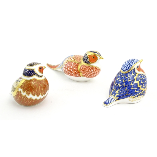 126 - Three Royal Crown Derby paperweights modelled as birds, comprising robin, chaffinch and pheasant. Ea... 