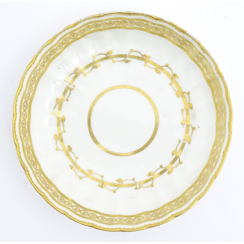 129 - A Derby fluted saucer with gilt banded detail. Marked under. Approx. 5 1/2