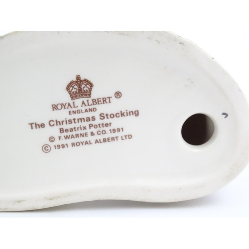 135 - A Royal Albert Beatrix Pottery group, titled The Christmas Stocking, no. 60A. Marked under. Approx. ... 