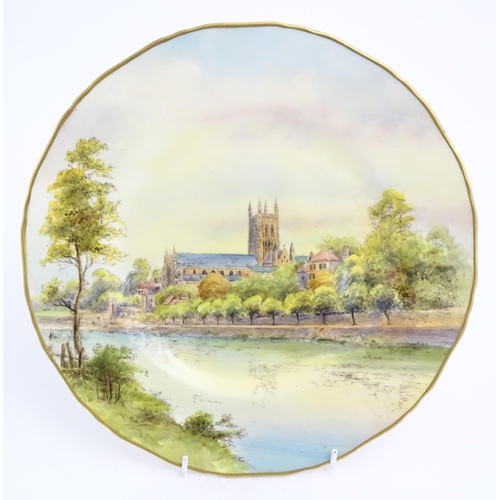 138 - A Royal Worcester plate depicting Worcester cathedral from the River Severn. Marked under. Approx. 1... 