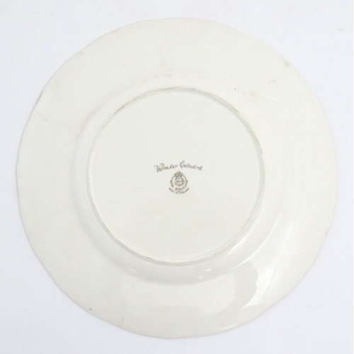 138 - A Royal Worcester plate depicting Worcester cathedral from the River Severn. Marked under. Approx. 1... 