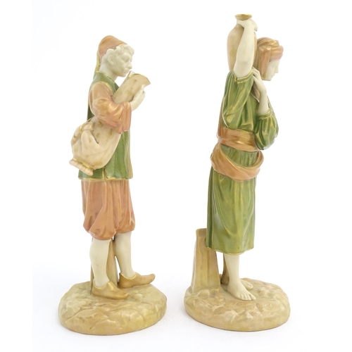 139 - A pair of Royal Worcester blush ivory figures depicting two water carriers holding vases. Marked und... 