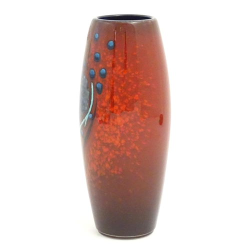 145 - An Alan Clarke studio pottery vase of cylindrical form with abstract red glaze detail. Marked under.... 